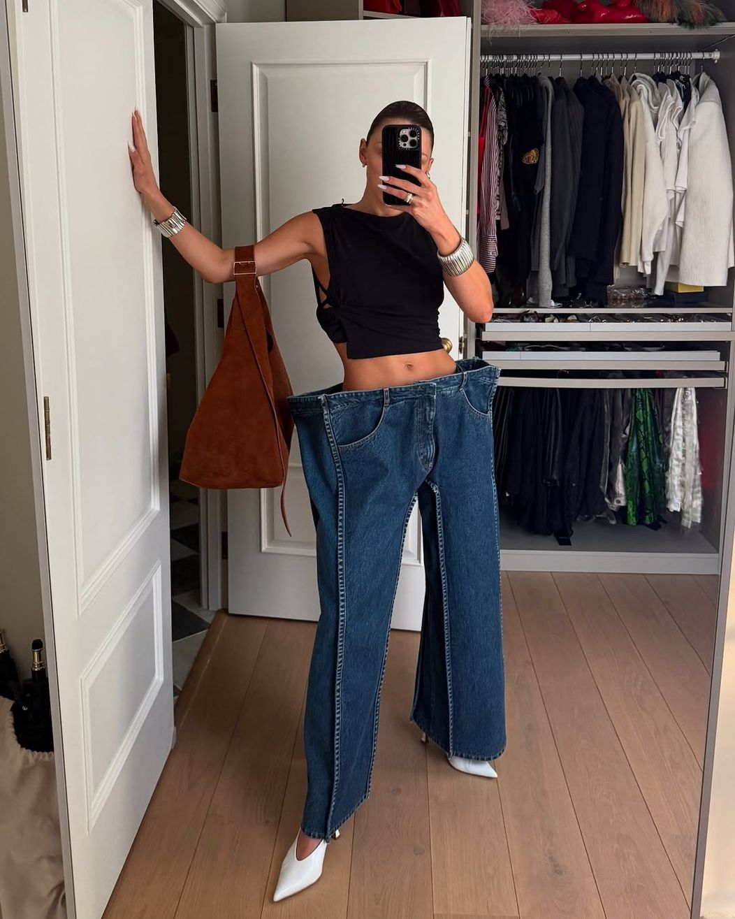 Not for everyone — and that’s the point. @maryfurtas styling our avant-garde square silhouette jeans for everyday life like a pro. ❤️_🔥🟦Jeans are now available for preorder at kseniaschnaider.com — made (2)