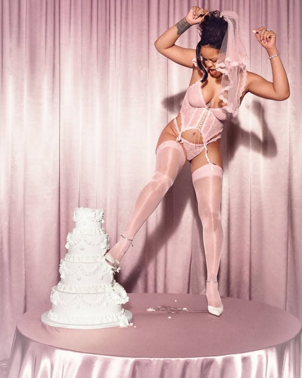 Rihanna is the sort of bride that will have you blushing.   The mother of two modeled her brand, Savage X Fenty’s, bridal lingerie collection while sporting the ring on 𝓉𝒽𝒶𝓉 finger, a veil and a garte (2)