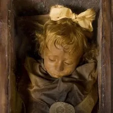 The mummy of Rosalia Lombardo .In the depths of an obscure Sicilian catacomb, there lies a young girl in an open casket. Her name is Rosalia Lombardo and she died at the tragically young age of two due to co