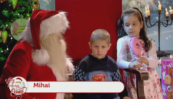 Mos Craciun exista! Ce cadouri a primit micutul Mihai