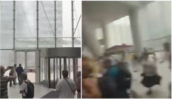 Scene dramatice din timpul furtunii din București. Vântul puternic a smuls o ușă rotativă dintr-o clădire de birouri. Reacția oamenilor