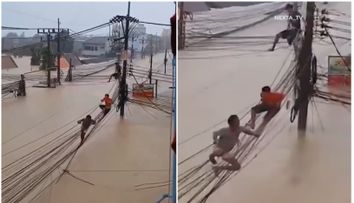 Imagini șocante din Thailanda: oamenii riscă tot, escaladând cablurile suspendate pentru a scăpa de inundații uriașe