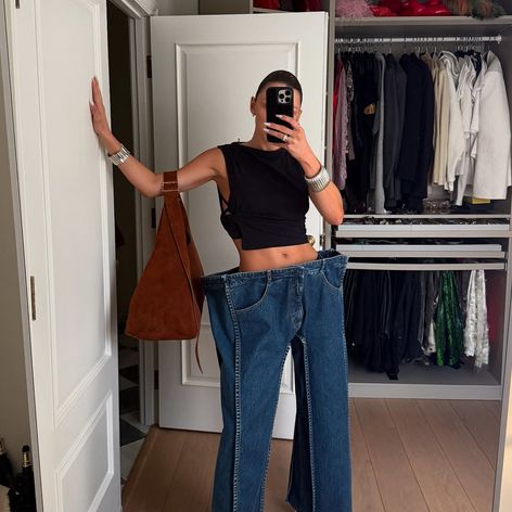 Not for everyone — and that’s the point. @maryfurtas styling our avant-garde square silhouette jeans for everyday life like a pro. ❤️_🔥🟦Jeans are now available for preorder at kseniaschnaider.com — made (2)