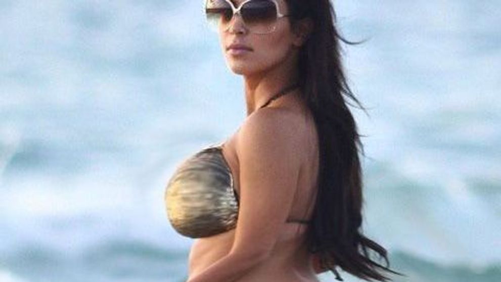 Posesoarea celui mai sexy posterior, Kim Kardashian, a luat <span style=