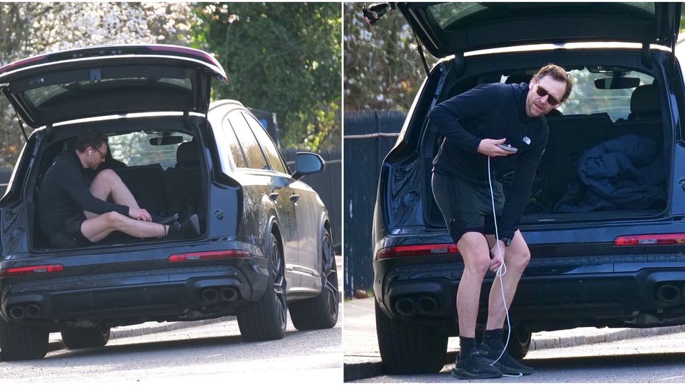 A fost surprins de paparazzi în timp ce se schimba în portbagajul mașinii, chiar în mijlocul străzii! Imagini virale cu Tom Hiddleston, actorul care și-a transformat autoturismul într-un vestiar
