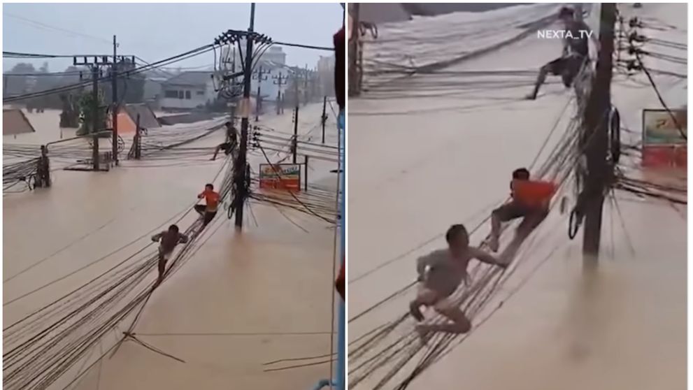 Imagini șocante din Thailanda: oamenii riscă tot, escaladând cablurile suspendate pentru a scăpa de inundații uriașe